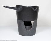 Copco Michael Lax cast iron fondue sauce, a sauce warming pot with stand in matte black, a stylish and modernist butter warmer, 1970s