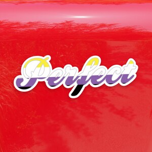 May include: A white sticker with black outline and the word "Perfect" in a stylized font. The word is colored with the colors of the non-binary pride flag: yellow, white, purple, and black.
