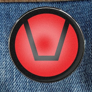 May include: A red and black pin with a symbol that looks like a stylized letter U.