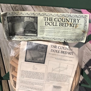 May include: A craft kit for making a doll bed. The kit includes wooden bed frame parts, flat reed splints, and instructions. The kit is easy to follow and comes with a skill level of easy. The bed measures 11 x 14 inches and is 8 inches tall at the headboard.