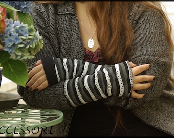 Cuffs Arm cuffs on both sides or with thumb hole black white gray stripes lined with fleece hand warmers soft warm cuddly