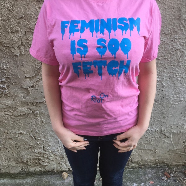 Feminism is soo Fetch t shirt screen printed on pink shirt with royal blue ink.