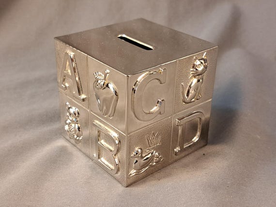 Silver plated cube money box. Silver plated cube money box.