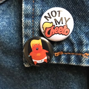 Not My Cheeto button or Mini Baby Trump Blimp