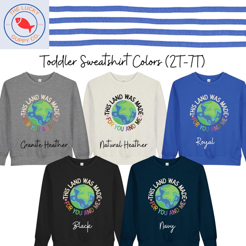 K&ouml;nnte beinhalten: Eine Auswahl an Sweatshirts f&uuml;r Kleinkinder in den Farben Grau, Creme, K&ouml;nigsblau, Schwarz und Marine. Jedes Sweatshirt zeigt eine Grafik der Erde mit dem Text "This land was made for you and me."