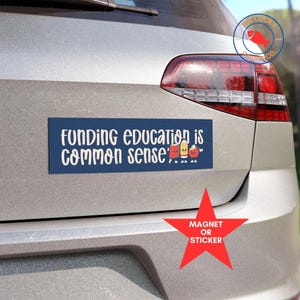 May include: A blue and white bumper sticker with the text "Funding education is common sense" and a row of cartoon school supplies. The sticker is on the back of a silver car. The sticker is available as a magnet or sticker.