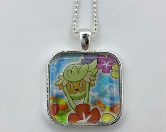Collar Comfey de Pokémon - Colgante holográfico de carta de Pokémon - Collar o llavero de Pokémon - Collar de carta de Pokémon - Colgante de Pokémon - Holográfico