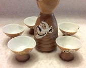 Vintage Japanese Sake pourer 5 cups fine porcelain.