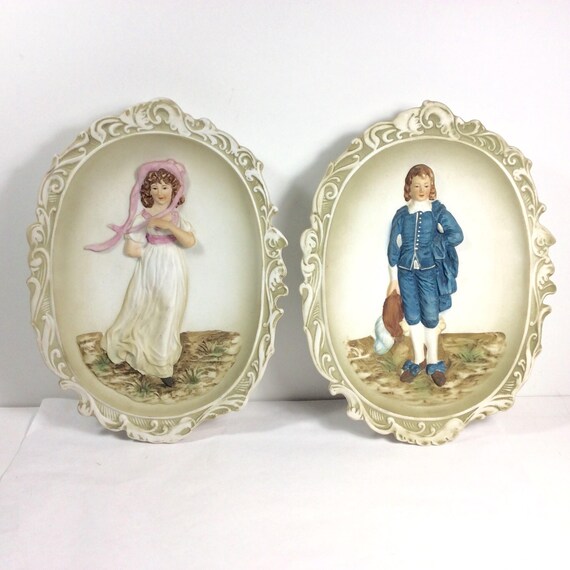 pinky and blue boy figurines