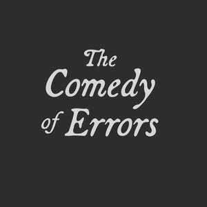 May include: A dark gray background with the words "The Comedy of Errors" in a stylized, off-white font. The text is arranged in three lines, with "The" on top, "Comedy" in the middle, and "of Errors" at the bottom.