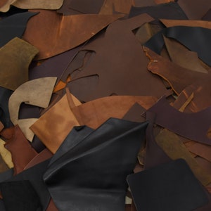 Oil tanned genuine leather scraps in neutral tones.  Sold in 1-pound increments.