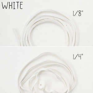 May include: Two spools of white leather cord. The top spool is 1/8 inch thick and the bottom spool is 1/4 inch thick.
