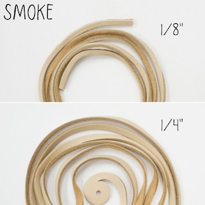 May include: Two pieces of leather cord in the colour smoke. The cord on top is 1/8 inch thick and the cord on the bottom is 1/4 inch thick.