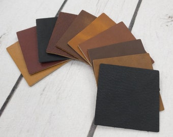 May include: A variety of leather swatches in different shades of brown, tan, and black. The swatches are arranged in a semi-circle, with the darkest shade at the bottom and the lightest shade at the top.
