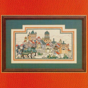 May include: A cross-stitch pattern for a medieval city scene with a knight on horseback. The pattern is titled "The Knight Errant" and is designed by Patricia Andrle. The pattern is part of a series called "Counted Illuminations".
