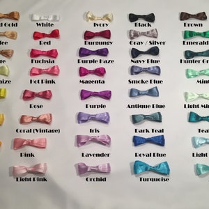 May include: A chart of 36 different colored satin ribbon bows. The colors include: Old Gold, White, Ivory, Black, Brown, Toffee, Red, Burgundy, Gray/Silver, Emerald Green, Beige, Fuchsia, Purple Haze, Navy Blue, Hunter Green, Baby Maize, Hot Pink, Magenta, Smoke Blue, Mint, Yellow, Rose, Purple, Antique Blue, Light Mint, Daffodil, Coral (Vintage), Iris, Dark Teal, Teal, Orange, Pink, Lavender, Royal Blue, Light Blue, Light Pink, Orchid, Turquoise, and Aqua.
