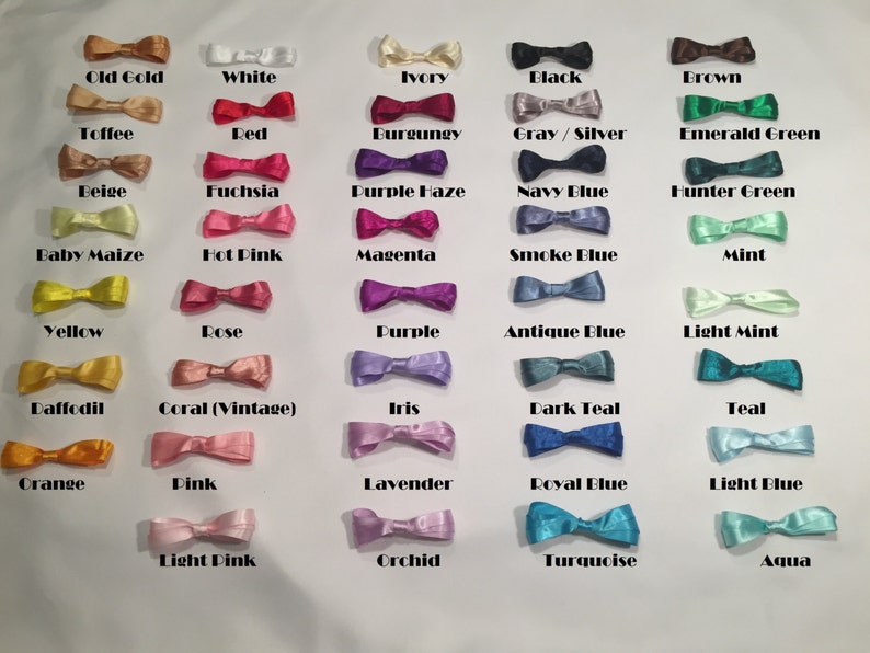 May include: A chart of 36 different colored satin ribbon bows. The colors include: Old Gold, White, Ivory, Black, Brown, Toffee, Red, Burgundy, Gray/Silver, Emerald Green, Beige, Fuchsia, Purple Haze, Navy Blue, Hunter Green, Baby Maize, Hot Pink, Magenta, Smoke Blue, Mint, Yellow, Rose, Purple, Antique Blue, Light Mint, Daffodil, Coral (Vintage), Iris, Dark Teal, Teal, Orange, Pink, Lavender, Royal Blue, Light Blue, Light Pink, Orchid, Turquoise, and Aqua.