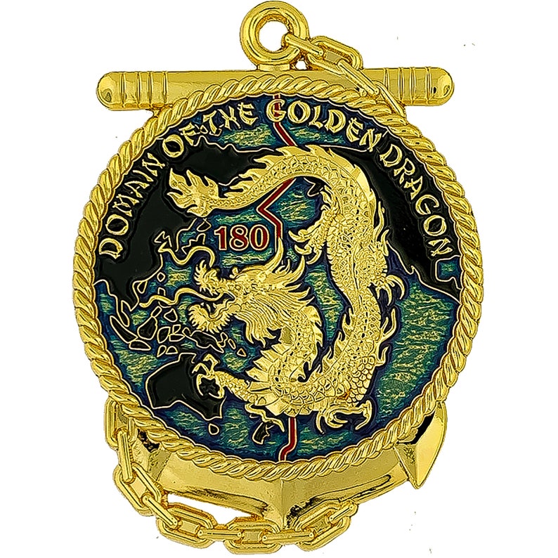 May include: A gold-colored medallion with a detailed dragon design at the center, surrounded by the text "DOMAIN OF THE GOLDEN DRAGON" and the number "180". The medallion has a rope-like border and an anchor at the bottom, with a chain and a bar at the top.