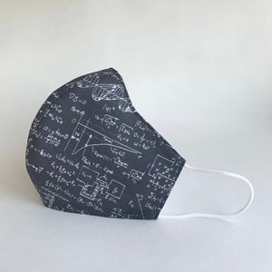 May include: Black face mask with white mathematical equations and a butterfly design printed on it. The mask has white elastic ear loops.
