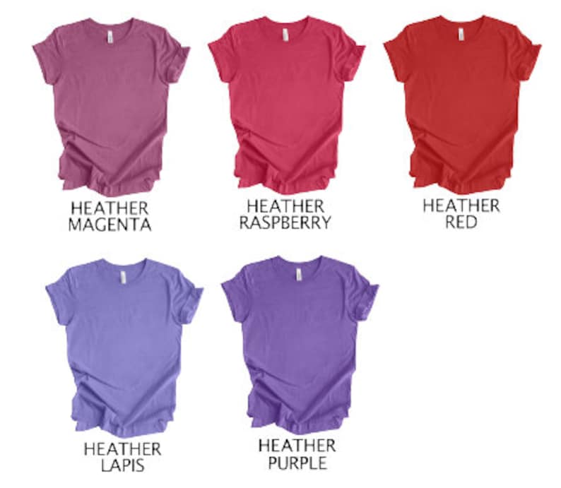 May include: Five heathered t-shirts in various colors: heather magenta, heather raspberry, heather red, heather lapis, and heather purple. Each shirt is a solid color with a crew neck.