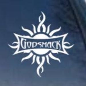 May include: White vinyl decal of the band Godsmack's logo. The logo features a stylized sun with flames and the band's name in a banner.