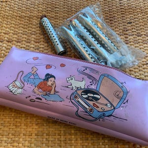Vintage Aluminum Curlers of Various Sizes and 1950’s Lavender Vinyl Illustrated Curler Bag