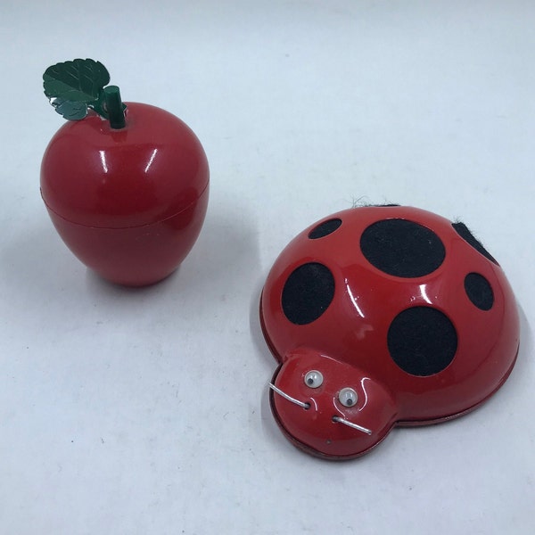 A Pair of 1960’s Novelty Retractable Tape Measures: Plastic Red Apple and Metal and Felt Ladybug Tape Measure and Pincushion Japan.