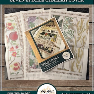 May include: A printed paper pattern for a "Seven Species Challah Cover" with a full-color print. The pattern includes a project guide and suggested fabric. The pattern info is 213 x 338 stitches. The image also includes color and symbol charts.