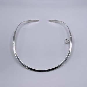 Charles Albert 4 mm Flat Round Smooth Neck Wire Open to the Back and created in Plated Sterling Silver