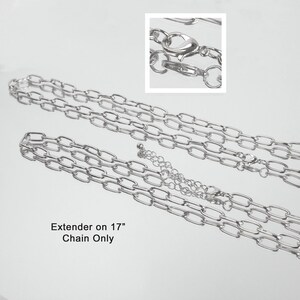 May include: Silver-toned chain necklace with an extender. The chain is made of oval links and has a lobster clasp closure. The text in the image reads "Extender on 17" Chain Only."