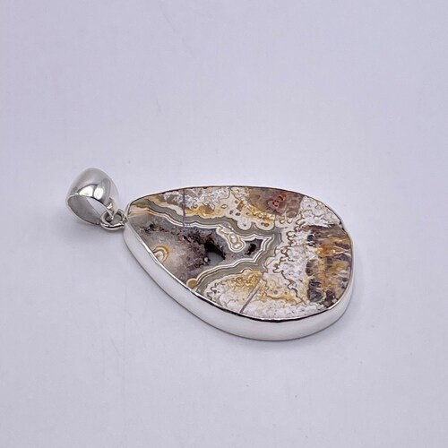 Charles shops Albert Crazy Lace Agate Teardrop Cabochon Pendant set in Fine Sterling Silver with Visible Druzy