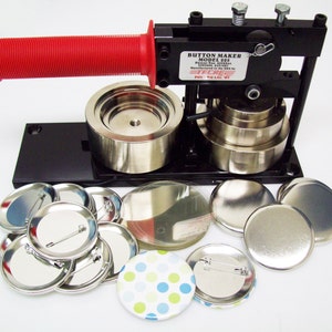 May include: A black button maker with a red handle, a set of metal button parts, and a variety of blank and decorated buttons. The button maker is labeled "Button Maker Model 325".