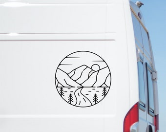 May include: Black and white line art sticker of a mountain range with a river flowing through it, a sun, and trees. The sticker is on a white van.