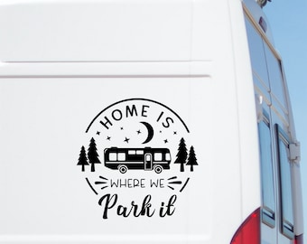 May include: Black and white decal sticker with the text "Home is where we park it" and a silhouette of a motorhome, moon, and stars.