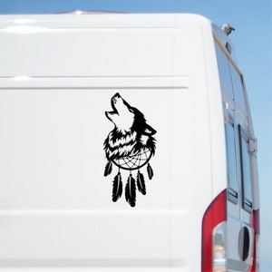 May include: Black and white silhouette of a wolf howling at the moon with a dreamcatcher behind it. The wolf is inside a circle with feathers hanging down.
