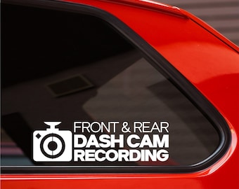 May include: White vinyl sticker with a camera icon and the text "FRONT & REAR DASH CAM RECORDING" on a red car window.