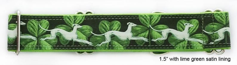 May include: A 1.5-inch wide dog collar featuring a repeating pattern of white greyhounds running across a black background with green shamrocks. The collar includes silver-toned metal hardware and a lime green satin lining along the edges.