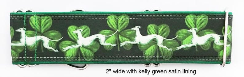 May include: A 5.08 cm wide dog collar featuring a repeating pattern of white greyhound silhouettes running across a dark background with vibrant green shamrocks. The collar includes silver-toned metal hardware and a kelly green satin lining.