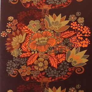 May include: A repeating pattern of orange, brown, and gold floral designs on a dark brown background. The design features stylized flowers and leaves.