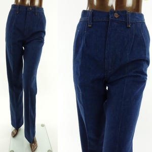 May include: A pair of dark blue denim jeans with a high waist and a straight leg.