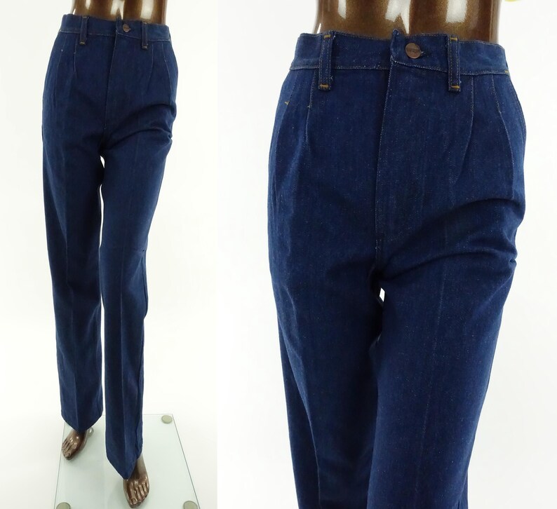 May include: A pair of dark blue denim jeans with a high waist and a straight leg.