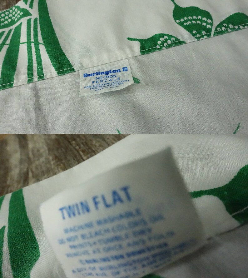 May include: White twin flat sheet with a green floral pattern. The sheet is made of a no-iron percale fabric blend of 50% cotton and 50% polyester.