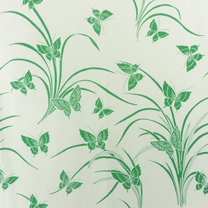 May include: A white background with a repeating pattern of green butterflies and green blades of grass.