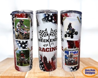 May include: A white tumbler with a red, white, and blue American flag design. The tumbler has a clear lid and a handle. The tumbler has images of people riding ATVs and the text "Weekends are for Racing".