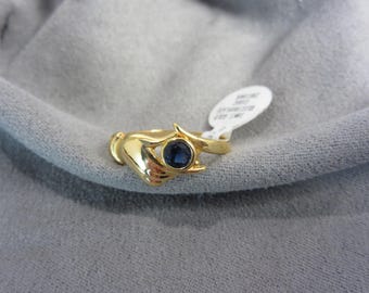 Vintage 18k Gold Electroplated Blue Cubic Zirconia Ring, Hand holding CZ