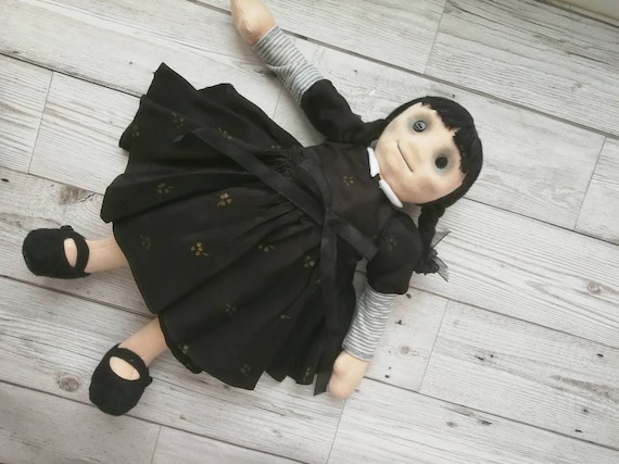 wednesday addams with her doll