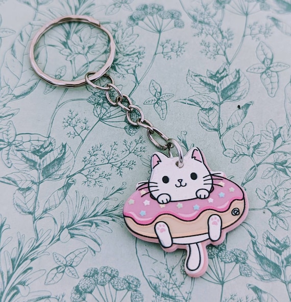 ドーナツキーホルダーに入った猫、白い猫好きへのギフト、かわいい