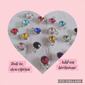 May include: Assortment of colourful crystal birthstone charms with silver settings. Add on birthstone. Link in description.