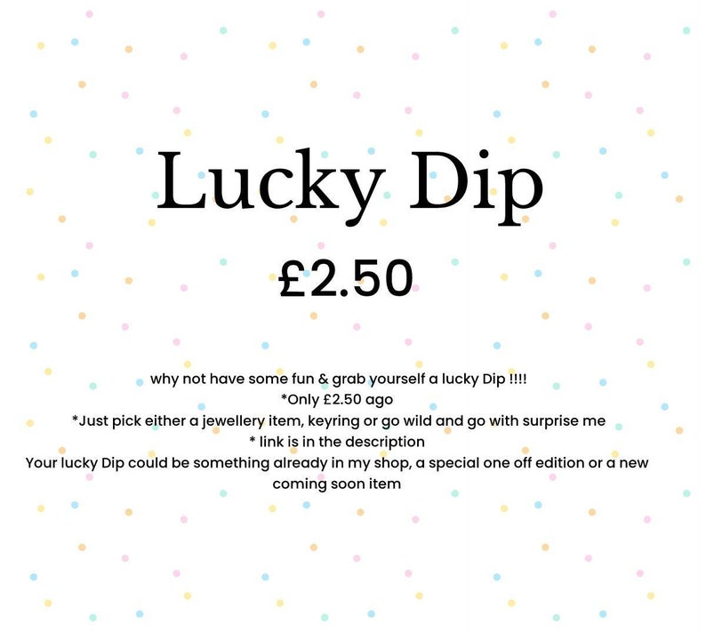 May include: White background with pastel polka dots. Text reads "Lucky Dip" in large black letters, followed by "&pound;2.50". Additional text below describes the item as a surprise selection of jewelry, keyrings, or other items.