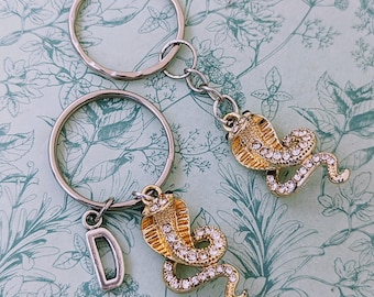 Sleutelhanger slang, sleutelhanger slang, geschenken slangenliefhebber, geschenken slang moeder, slangaccessoires, geschenken met reptielthema, geschenken reptielenliefhebber,